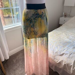 Bebe floral maxi skirt with a colorful gradient print and a flowing design